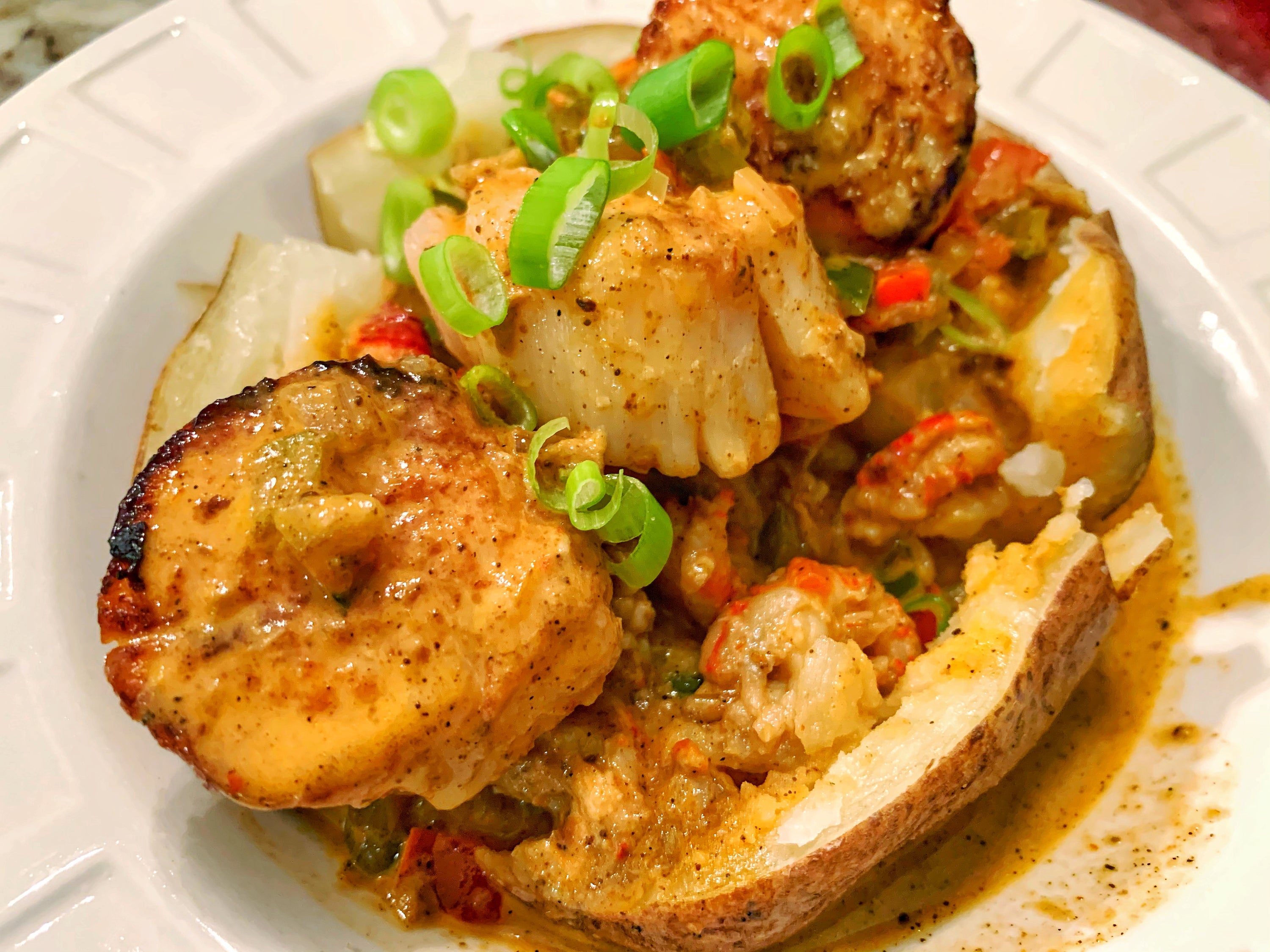 Chilau Loaded Baked Potato with Scallops and Crawfish